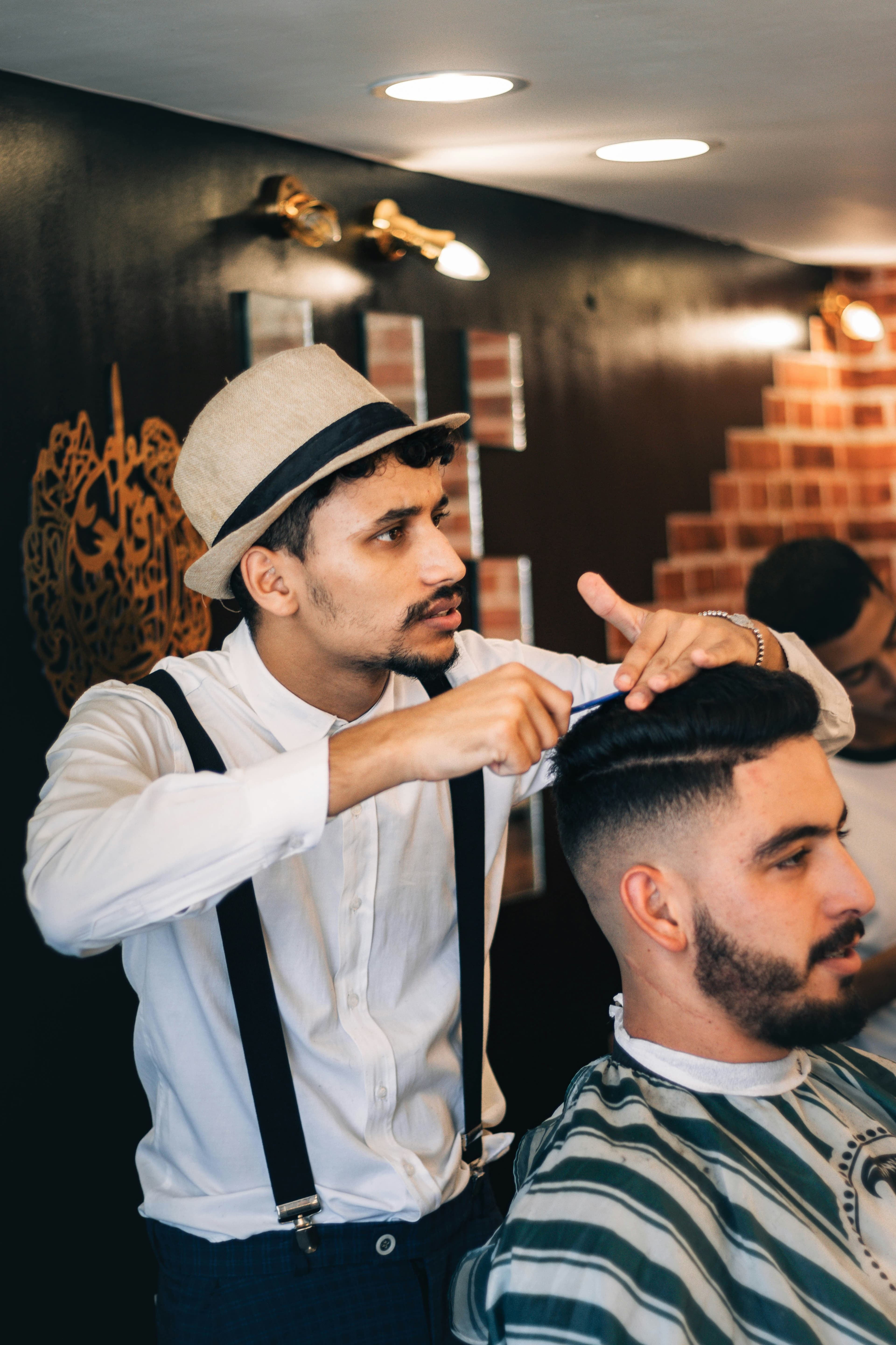 A barber giving a customer a fade